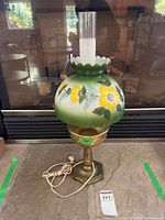 Full view of lamp showing hand-painted shade, chimney and brass base