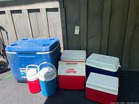 Group shot of all coolers and jugs