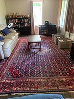 Full room view showing entire rug design, colors, dimensions relative to furniture