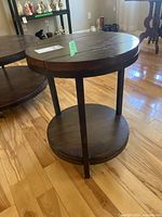Full view of round two-tier wooden side table