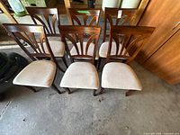 Front angled view showing all six chairs, back design, seat upholstery, overall condition