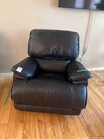 Front view of black swivel rocker recliner chair