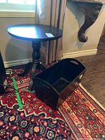 Side table and storage bin on patterned rug