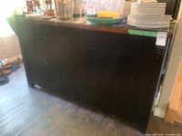Front view of black wooden bar