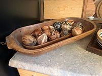 Two nested trencher bowls with decorative balls
