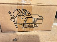 Original box side with line drawing of vise