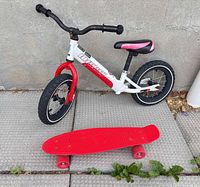 Full view of balance bike and skateboard