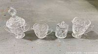 Full group shot of all four pressed glass pieces