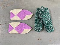 Slippers and mittens side by side on floor
