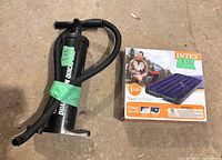 Overall lot showing boxed mattress and pump