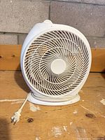 Front view of Likewise TSA-F10 fan showing circular grill and power cord