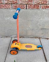 Full side view of scooter showing overall design and colours