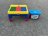 Play table and storage bucket together