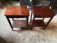 Top view of both end tables showing surface wear and overall design