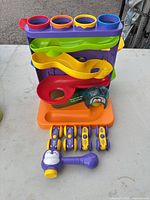 Front view showing track unit, six cars, hammer and penguin ball
