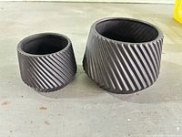 Both planters side by side showing grooved exteriors and size difference