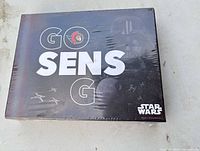 Front of sealed box with Go Sens Go text, Star Wars graphics