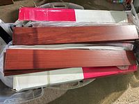 Box with two teak planks displayed
