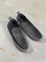 Top view of pair of black rubber shoe covers