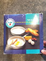 Retail box front showing Venture Camping branding and cookware image