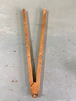 Full view of wooden compass scribe closed to V shape