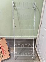 Full view of white metal 6-tier shoe rack standing