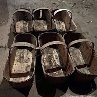 Group of six rectangular wood slat veneer baskets showing overall form