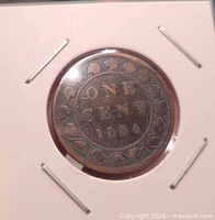 Reverse of 1884 Canadian large cent in holder