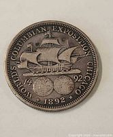Reverse side showing ship and globes with legends