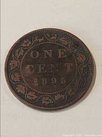 Reverse of 1895 Canada one cent with maple leaf wreath and date