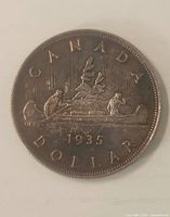 Reverse view showing Voyageur canoe design and date 1935