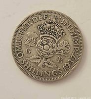 Reverse of 1937 two-shillings coin featuring crowned rose, thistle, shamrock, date