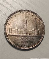 Reverse side showing Parliament Buildings design and inscriptions