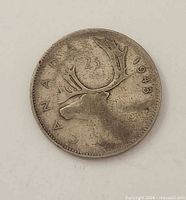 Reverse showing caribou and 1943 date