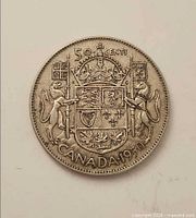 Reverse of 1950 Canadian 50-cent coin showing crowned coat of arms with supporters