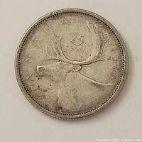 Reverse side showing caribou, visible wear