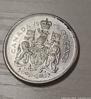 Reverse side of 1959 Canadian 50-cent coin showing Coat of Arms