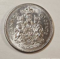 Reverse of 1961 Canadian 50-cent coin with Coat of Arms