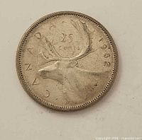 Reverse side of 1962 Canadian 25-cent coin showing caribou design