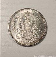 Reverse of 1962 Canadian 50-cent coin showing Coat of Arms