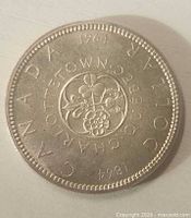 Reverse side of 1964 Canadian silver dollar showing Charlottetown–Quebec design