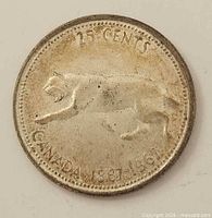Reverse side with bobcat and dual dates 1867-1967