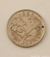 Reverse of 1985 Bermuda 10-cent coin with lily and date