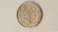 Reverse of 2017 Wings of Peace dime showing dates and design