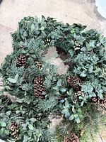 Evergreen wreath with pine cones and mixed greenery