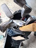 Top view of golf bag showing Northwestern irons and wedges