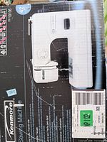 Front of retail box showing image of Kenmore sewing machine and model information