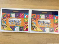 Two Lakeshore Learning Keepsake Portfolio cases side by side