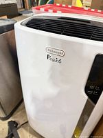 Front and side view of DeLonghi Pinguino portable air conditioner