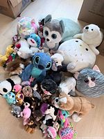 Top view of entire assortment of plush toys on floor